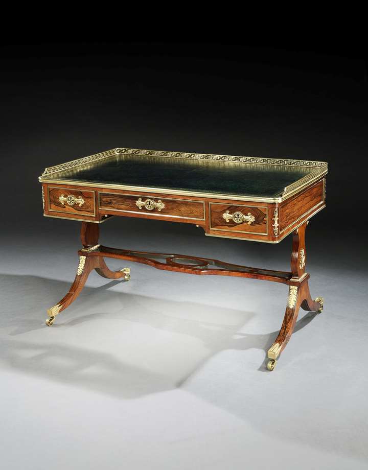 A REGENCY BRASS MOUNTED ROSEWOOD WRITING TABLE